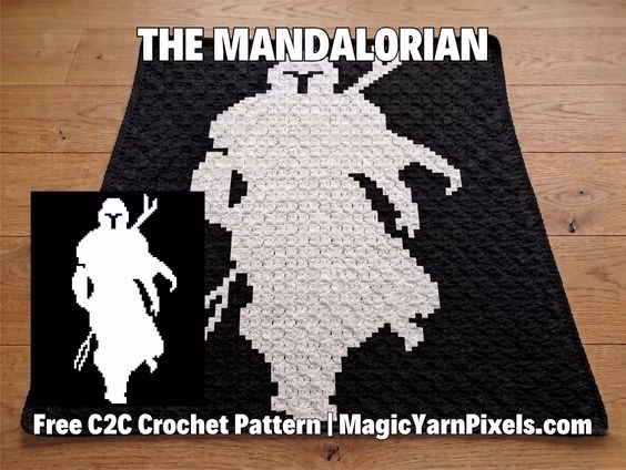 A black and white C2C crochet blanket showing a pixel art silhouette of The Mandalorian. The image includes text for a free pattern at MagicYarnPixels.com. Original design by Ariana of MagicYarnPixels.
