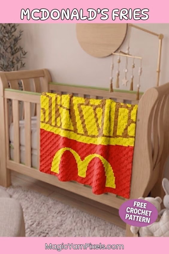 A vertical Pinterest pin graphic with pink borders featuring a red corner-to-corner (C2C) crochet baby blanket draped over a wooden crib. The blanket showcases a pixel art design of french fries inside a red container with the yellow golden arches logo. The image includes text overlays that read "MCDONALD'S FRIES", "MagicYarnPixels.com", and a purple circular badge reading "FREE CROCHET PATTERN". Original Design by Ariana of MagicYarnPixels.