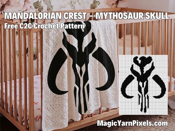 A crochet baby blanket draped over a wooden crib featuring a large black Mandalorian crest Mythosaur skull design on a cream-colored background. Text overlay reads "MANDALORIAN CREST – MYTHOSAUR SKULL Free C2C Crochet Pattern MagicYarnPixels.com". An inset image shows the black and white pixel grid graph for the pattern. Original design by Ariana of MagicYarnPixels.