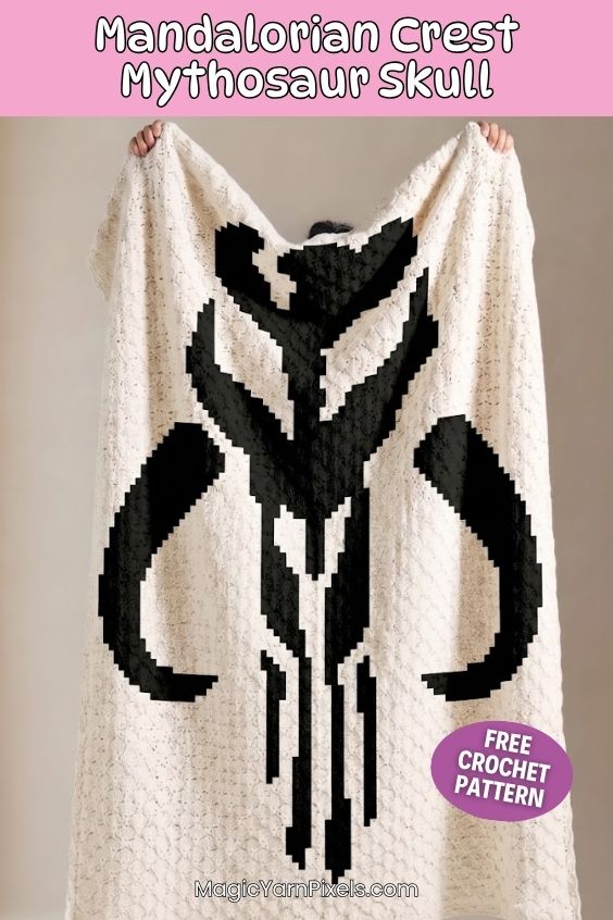 A person holding up a large, cream-colored textured crochet blanket displaying a bold black Mandalorian crest Mythosaur skull design. A pink banner at the top reads "Mandalorian Crest Mythosaur Skull" and a purple circle sticker graphic at the bottom right reads "FREE CROCHET PATTERN". The website text "MagicYarnPixels.com" is printed at the bottom. Original design by Ariana of MagicYarnPixels.