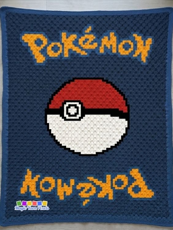 Finished Pokémon card-inspired C2C crochet blanket with a centered Poké Ball, yellow pixel-style lettering, navy blue background, and matching blue border. Original design by Ariana of MagicYarnPixels.