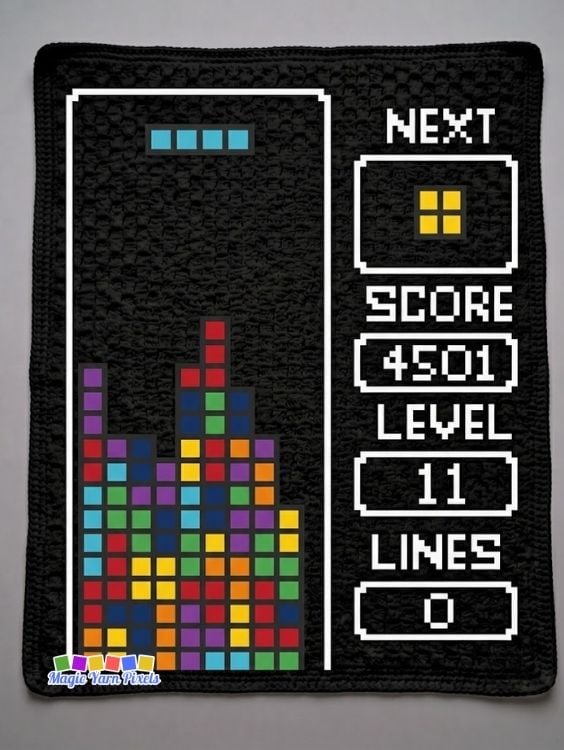 Finished Retro Arcade Blocks C2C crochet blanket featuring colorful pixel blocks, a retro arcade score panel, and a black border. Original design by Ariana of MagicYarnPixels.