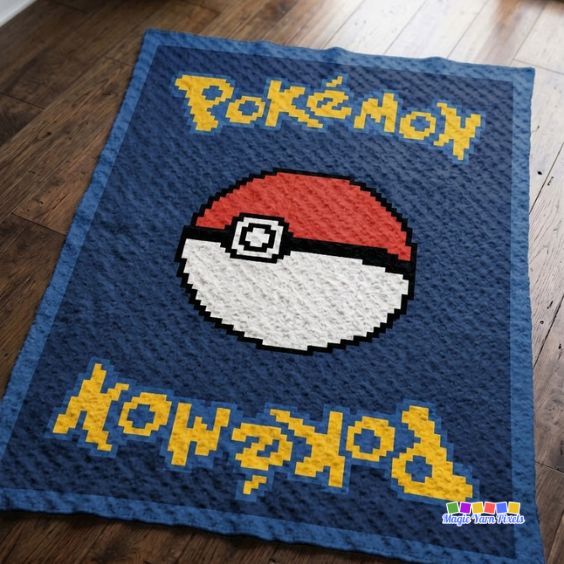Finished C2C crochet blanket with a Poké Ball centered on a navy background and yellow Pokémon-inspired lettering at the top and bottom. Original design by Ariana of MagicYarnPixels.